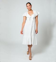 Ashlyn Midi Dress | Ivory Dresses Cleobella Feminine Cotton Midi Dress For Daywear, Feminine Cotton Midi Dress For Beach, Cotton Feminine Midi Dress For Beach, Feminine Cotton Dresses For Daywear, White Cotton V-neck Midi Dress, Sustainable Dresses, Sustainable Wardrobe, Staple Dress, Dobby Fabric