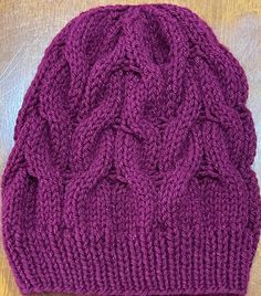 This lightweight beanie is knitted in Cable Knit  Slouchy Beanie style, that will help keep you warm during the chilly seasons. The vibrant Boysenberry Purple color will go with any outfit in your wardrobe.  This beanie is knitted with love and the hope that you or whomever you gift it to will love it for years to come.  Easy care, wash on gentle and dry on low heat or allow to air dry. Part of the proceeds from this sale will go towards helping those in need in the Pacific Northwest Communities.  Thank you for your support in advance! Fall Crochet Cable Knit Hat, One Size, Fall Cable Knit Crochet Hat One Size, One Size Cable Knit Crochet Hat For Fall, Fall Cable Knit Beanie One Size, Cable Knit Beanie For Cold Weather, Casual Purple Knitted Beanie, Casual One Size Cable Knit Beanie, Casual Hand Knitted Purple Beanie, Cable Knit Beanie Cap One Size