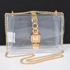 Carry your essentials in style with our Transparent Buckle Crossbody Bag! This clear purse features a unique buckle closure and a trendy chain strap. Perfect for concerts, festivals, or any event where a clear bag is required. 8W*5.5H*2.5D Trendy Clear Shoulder Bag As Gift, Trendy Clear Shoulder Bag For Gifts, Trendy Shoulder Bag With Clear Strap For Party, Trendy Party Shoulder Bag With Clear Strap, Party Rectangular Shoulder Bag With Clear Strap, Trendy Party Bags With Clear Strap, Trendy Clear Shoulder Bag For Party, Party Bag With Clear Strap, Trendy Clear Crossbody Satchel