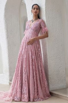 Blush pink floor length anarkali with all over hand embroidery using sequins, cutdana, stones, beads work in geometric pattern. Comes along with an embroidered dupatta. - Aza Fashions Pink Sequin Dress For Navratri, Pink Embroidered Gown For Diwali, Pink Anarkali Set With Chikankari Embroidery For Reception, Anarkali Sequin Gown For Diwali, Pink Floor-length Anarkali Set For Reception, Diwali Anarkali Gown With Sequins, Pink Sequined Anarkali Set For Eid, Sequined Anarkali Set For Reception And Eid, Pink Anarkali Gown For Reception