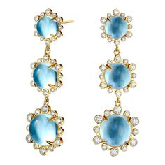 Created in 18 karat yellow gold Blue Topaz 17 carats approx. Diamonds 1 carat approx. Post backs for pierced ears Limited Edition  Crafted from 18-karat yellow gold, these earrings boast a majestic blue topaz weighing approximately 17 carats, and are accented with diamonds totaling approximately one carat. For pierced ears, these limited-edition earrings feature post backs.  About the Designers    Drawing inspiration from little things, Dharmesh & Namrata Kothari have created an extraordinary and refreshing collection of luxurious jewels. True believers of destiny, they always feel that the possibilities of design - and life - are limitless when people work together. Formed in 2003, Syna Jewels has grown through enduring relationships with well known, established companies and have evolved Yellow Gold Earrings With Blue Topaz Gemstone, Blue Diamond-accented 14k Gold Earrings, Blue Diamond Accent Earrings In 14k Gold, Blue Diamond Accent 14k Gold Earrings, Luxury Blue Topaz Earrings With Prong Setting, Blue Diamond Pierced Earrings, Yellow Gold Blue Topaz Earrings, People Working Together, Gold Topaz