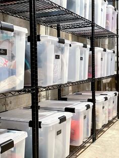 the shelves are filled with plastic containers and bins for storing items or other things