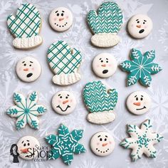 snowmen and cactus decorated cookies sitting on top of a white table covered in frosting