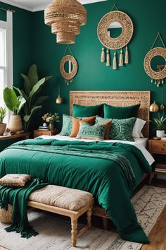 a bed with green sheets and pillows in front of a window, surrounded by potted plants