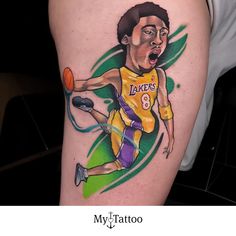 a man with a basketball tattoo on his arm and the image of a lakers player