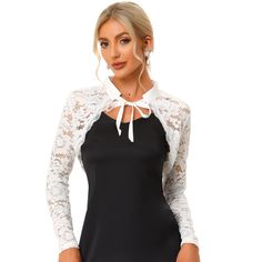 This lace cardigan is designed with a long sleeve, a unique scalloped hem with a lace trim, and a cropped shrug. The shrug top features a stand collar and an open front design that can make you wear it on and down. The elegant bolero shrug is perfect for dress-up to complete the charming look. Great for spring/fall, casual daily, cocktail, evening parties, wedding parties, work, dating, and coffee shops. Spring Fitted Shrug With Lace Trim, Fitted Shrug With Lace Sleeves For Spring, Spring Lace Shrug With Lace Sleeves, Fitted Lace Shrug With Lace Trim, Spring Party Shrug With Lace Trim, Fitted White Lace Top With Contrast Lace, White Fitted Lace Top With Contrast Lace, Fitted Party Shrug With Lace Trim, Elegant Fitted Cardigan With Lace Trim