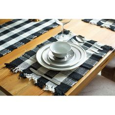 the table is set with black and white placemats