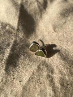 Handmade sterling silver Cracked Sea Glass Earrings, made with recycled silver, and genuine Sea Glass from the Jurassic Coast. These earrings have one small piece of cracked green Sea Glass each, and are very dainty and elegant.  These Earrings are a perfect gift for a special occasion, and is perfect for Sea Glass lovers! All of the silver on the earrings are 925 Sterling Silver, including the small butterfly backs or hooks! Feel free to message me for any additional information, or for commissions/custom requests! Small Butterfly, Jurassic Coast, Sea Glass Earrings, Jewellery Gifts, Stud Jewelry, For Her Gifts, Green Sea, Recycled Silver, Recycled Sterling Silver