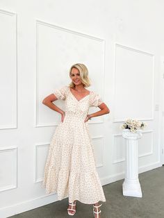 Introducing our custom, one-of-a-kind Timeless Grace Floral Puff Sleeve Midi Dress! This exclusive dress features a beautiful hand-designed Flourish in Frills, making it truly unique and unavailable anywhere else. The bump-friendly design, sweet floral print, sweetheart neckline, and lace detail add a touch of girly charm. Comfy and chic - the perfect dress for any occasion. Tiered skirt Puff sleeves Elastic stretch at bust and sleeves Rouching at bust Lace trim detail Sweetheart neckline 100% C Cream Puff Sleeve Midi Dress For Garden Party, Beige Dress With Fitted Bodice For Garden Party, Cream Puff Sleeve Dress For Garden Party, Tiered Dress With Fitted Bodice For Garden Party, Garden Party Dress With Fitted Bodice And Tiered Shape, Garden Party Tiered Dress With Fitted Bodice, Beige Puff Sleeve Flowy Dress, Beige Flowy Puff Sleeve Dress, Beige Flowy Dress With Puff Sleeves