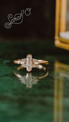 a close up of a ring on a table with a mirror in the back ground