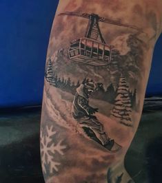 a man's leg with a ski lift and snowflakes on it