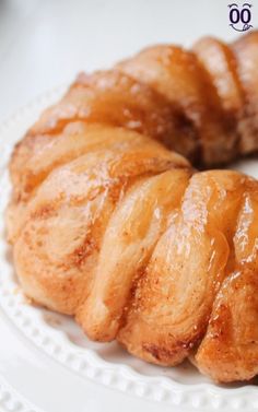 a white plate topped with pastry on top of a table