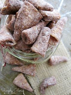 a glass bowl filled with dog treats on top of a table