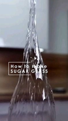 a close up of a glass vase with water coming out of it and the words how to make sugar gloss