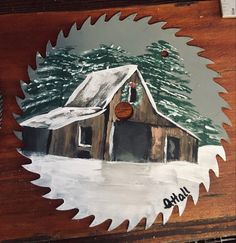 a painting of a barn with snow on the roof and trees in the back ground