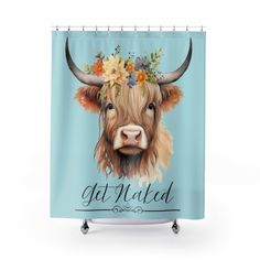 a shower curtain with an image of a cow wearing flowers on it's head