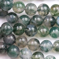 green and white marble beads are on display