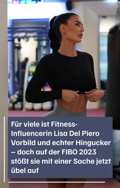 a woman standing in front of a gym machine with the words fit written on it