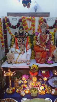 there are two people sitting in front of the altar