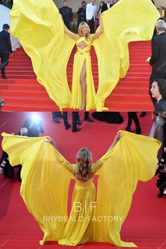 a woman in a yellow dress on the red carpet with her arms spread out and wings outstretched