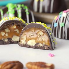 chocolate covered candies with nuts and sprinkles on the side, ready to be eaten