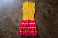 Vintage circa 1960's yellow and hot pink knit dress. High neck, sleeveless fitted silhouette and short hem.  The dress has alot of stretch except does not stretch at the hem and measures like an approximate women's US size small but could go up to a medium, see measurements for best fit.   LABELS: Little Lisa 100% Orlon Acrylic  CONDITION: The dress is in very good vintage condition with light wear. MEASUREMENTS (lying flat needs to be doubled when applicable): Waist 11" to 19" Bust 14" to 21" Shoulder 13" Hips 19" to 24" Hem width (does not stretch) 17 1/2" Length 44" SEE THE REST OF MY SHOP: www.etsy.com/shop/southwestvintage *International orders are sent USPS first class mail with no insurance and tracking is not guaranteed, please contact me to upgrade shipping Pink Knit Dress, Dress High Neck, Mini Sweater, Knit Dresses, High Neck Sleeveless, Pink Knit, Nice Clothes, Dr Closet, Mini Sweater Dress