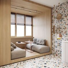 a living room filled with furniture next to a wall covered in flowered wallspaper