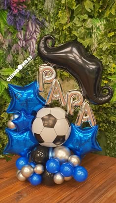 a soccer ball and some balloons on a table