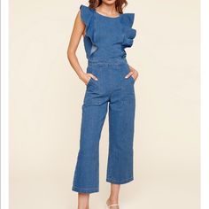 Sharon Ruffled Denim Jumpsuit Denim Ruffle Jumpsuit - Criss Cross Self Tie Back - Open Back - Zipper Closure - Pockets - Color: Light Denim Fabric 100% Cotton Chic Medium Wash Overall Jumpsuits And Rompers, Chic Dark Wash Overall Jumpsuits And Rompers, Chic Dark Wash Overall Jumpsuit, Medium Wash Sleeveless Denim Jumpsuit For Work, Sleeveless Medium Wash Denim Jumpsuit For Work, Sleeveless Dark Wash Denim Jumpsuit For Work, Sleeveless Denim Jumpsuits And Rompers For Work, Dark Wash Jumpsuits And Rompers For Summer Workwear, Summer Workwear Dark Wash Jumpsuits And Rompers