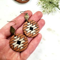 This listing is for one pair of round leather earrings with a geometric Aztec pattern. The base leather is a medium brown, and the accent colors are vintage white and black. These leather earrings are available in two sizes as shown in the pictures: 1. 2.25 inches in total length, 30 mm circle, antique bronze diamond connector 2. 2.5 inches in total length, 40 mm circle, antique bronze small circle connector **Hardware: -Ear wires and jump rings: antique brass, NICKEL FREE. **Packaging: Your ear Handmade Brown Geometric Earrings, Brown Geometric Earrings As Gift, Brown Geometric Earrings Gift, Rings Antique, Small Circle, Boho Macrame, Boho Leather, Round Leather, Aztec Pattern