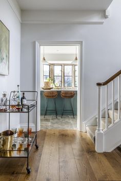 the hallway is clean and ready to be used as a dining room or living room