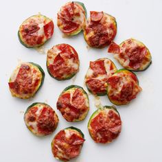 several slices of zucchini with tomato sauce and cheese on top, arranged in a circle