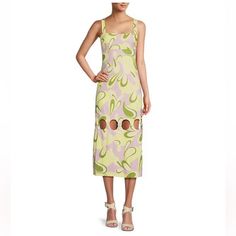 A-Line Silhouette Square Neckline Sleeveless Lined Midi Length Invisible Back Zip Hook-And-Eye Closure Approx. 41" In Length Cotton/Rayon/Elastane Dry Clean Imported. Sleeveless Cutout Sundress Maxi Dress, Sleeveless Cutout Midi Dress For Vacation, Sleeveless Cutout Midi Dress For Summer, Spring Sundress With Cutout, Spring Sleeveless Midi Dress With Cutout, Green Cutout Spring Dress, Cutout Sundress Midi Dress, Spring Beach Midi Sheath Dress, Spring Beach Sheath Midi Dress