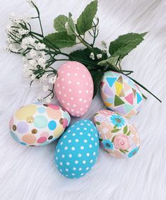 painted easter eggs with flowers on white fur