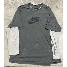 Brand: Nike Color: Gray Size: Men’s Xl Condition: Gently Used - Good Please Note: Color May Vary Slightly Due To Screen And Lighting. All Items, Unless Marked Nwt, Are Gently Used And May Have Signs Of Wear. Vintage Items Are 20-40 Years Old!!! We Try To Call Out Any Flaws/Imperfections In The Description. Please View All Photos For Condition And Feel Free To Message Me For More Pictures Or Measurements. Please Wash All Items Prior To Wear. Vintage Clothing May Run Smaller Than Modern Clothing. Nike Long Sleeve Cotton T-shirt, Nike Cotton Long Sleeve T-shirt, Nike Gray Crew Neck Shirt, Gray Long Sleeve T-shirt With Logo Print, Nike Gray Cotton Tops, Nike Long Sleeve Cotton Shirt, Nike Cotton Long Sleeve Shirt, Nike Casual Long Sleeve Shirt, Nike Long Sleeve