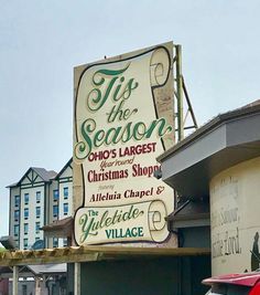 a large sign on the side of a building that says tis the season, ohio's largest christmas shop