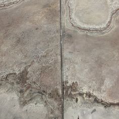 an aerial view of the desert with rocks and dirt on it's sides, looking like they are in different directions