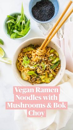 a bowl filled with noodles and vegetables next to chopsticks