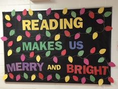 a bulletin board with christmas lights and reading makes us merry and bright