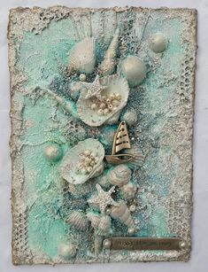 an art piece with shells and seashells on it