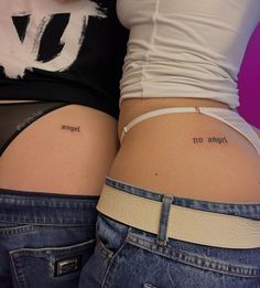 two women with tattoos on their butts, one has the word'no angel'tattooed on her lower back