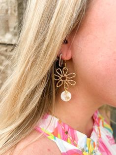 Enhance your ensemble with a delicate floral touch by donning these Maisy Earrings - Cream. Composed of a gold alloy, these earrings feature striking daisy charms crafted from 18K gold-plated hypoallergenic stainless steel, paired with lightweight and durable plant-based acrylic. Perfect for complementing a sundress, these earrings will add a playful and distinctive flair to your look. Daisy Charm, Shop Till You Drop, Gold Alloys, Chic Boutique, Beautiful Earrings, Fashion Boutique