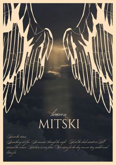 an image of two white angel wings with the words, i am mitski above them