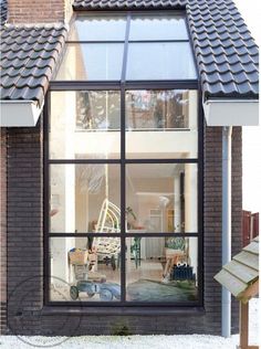 an open window on the side of a house