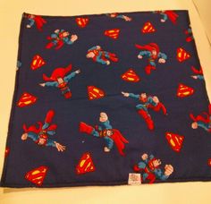 a blue bandana with supermans on it