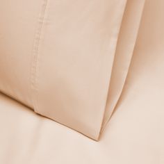 a close up view of the sheets and pillow cases