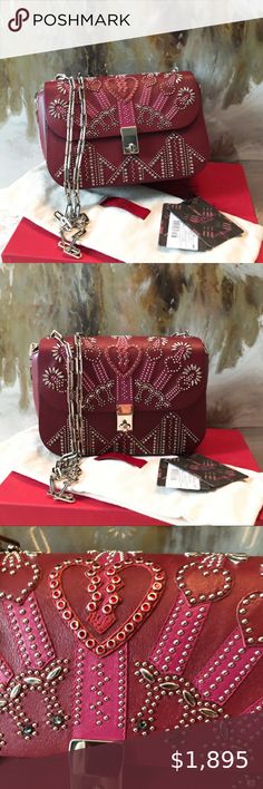 Valentino Love Blade Maroon Crystal Studded Bag Rare Authentic Valentino Garavani Maroon Crystal Stud Embellished Loveblade Chain Bag Retails $2985 plus tax.  Maroon smooth calfskin leather crossbody bag with silver-tone hardware, single chain-link shoulder strap, magenta and tonal leather heart accents with metal stud embellishments throughout, foilstamped logo accent at back exterior, tonal lambskin leather lining, three interior compartments, dual interior wall pockets; strap 20.5". No box or Maroon Crystal, Drew Scott, Leather Heart, Derek Hough, Christina Perri, Studded Bag, Adam Levine, Darren Criss, Diana Ross