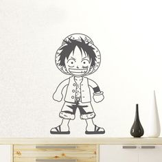 a wall decal with an image of a cartoon character wearing a pirate outfit and hat