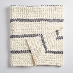 a crocheted dishcloth with two squares on it