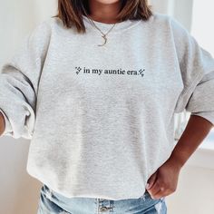 in my auntie era - Auntie Era is the BEST! A great embroidered gift for all aunts or aunties to be, this is the perfect sweatshirt to cozy up in while you cuddle your sweet niece, nephew, or to break out the fun in Homemade Shirts, Auntie Era, Auntie Shirts, Pregnancy Announcement Gifts, Aunt Shirts, Auntie Gifts, Embroidered Gifts, Small Business Ideas, Aunt Gifts